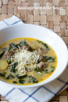 a bowl of sausage and kale soup on a woven place mat with a napkin