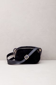 Embrace of-the-moment style in a luxurious fashion with the St. Moritz shearling belt bag. Crafted in Italy from amazingly soft shearling, this plush crossbody accessory features a full-grain calfskin leather strap and trim, plus beautiful gold-tone hardware throughout. Perfect for toting your phone, wallet, keys, and essential toiletries when you want to be hands-free on the go! Luxurious Fashion, Promo Gifts, Trim Styles, Sheepskin Slippers, St Moritz, Sheepskin Coat, Leather Belt Bag, Phone Wallet, Leather Coat