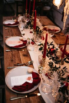 the table is set with candles and place settings