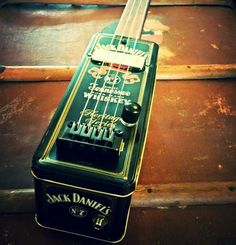 an electric guitar sitting on top of a wooden floor