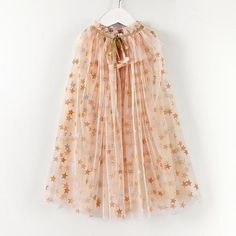 PRICES MAY VARY. ✨Princess Costume Cape for Girls: Sparkly and dreamy, this costume cape is as though the touch of a fairy godmother has made it. This girl's princess cape is sure to add glamour to any outfit for play, a birthday outfit or holiday dress. ✨Magic in the Details: Little girls princess cape comprises a layered apricot color tulle fabric that feature silver stars all over that shimmer in the light and will never shed. Cape has glimmering irisdescent sequined trims attached along the Winter Princess Costume, Kawaii Costumes Halloween, Fairy Cape, Princess Cloak, Diy Princess Costume, Fairy Godmother Costume, Princess Cape, Cloak Dress, Tulle Cape