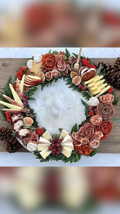 a wreath made out of flowers and pine cones