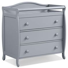 a baby crib with three drawers in grey