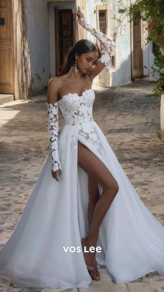 a woman in a white wedding dress is posing for the camera with her leg up