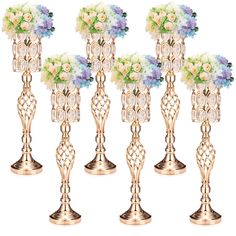 six gold vases filled with flowers on top of each other in front of a white background