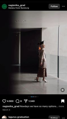 a woman standing in an empty room with her hand on her head and looking up at the ceiling