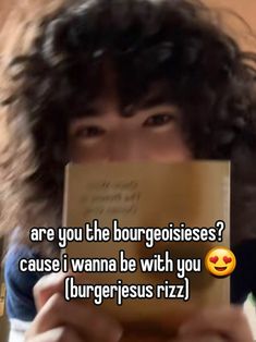 a woman holding up a book with the caption are you the bourgeoisies? cause i wanna be with you burgers rizz