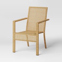 a wicker chair with arms and legs