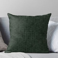 a green pillow sitting on top of a couch