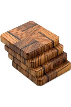 three wooden coasters stacked on top of each other