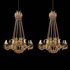 two chandeliers hanging from the ceiling in front of a black background, one is gold and the other is white