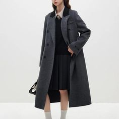 Discover Elegance with Our Dark Grey Woolen Coat Elevate your style with our 100% Wool Dark Grey Women's Long Woolen Coat. Designed for the modern Office Lady, this coat combines sophistication with comfort, making it a must-have for your wardrobe. Key Features: Material Composition: Crafted from luxurious 100% wool for a premium look and feel. Double Breasted Closure: The timeless double-breasted design adds a touch of classic charm. Notched Collar: A stylish turn-down collar enhances the overall elegance of the coat. Solid Pattern: The minimalistic solid pattern ensures versatility and easy pairing with your favorite outfits. Full-Length Sleeves: Stay warm and chic with the full-length sleeves, perfect for any season. Wide-Waisted Fit: The wide-waisted cut flatters your silhouette, creat Elegant Gray Wool Coat For Office, Elegant Gray Outerwear With Suit Collar, Elegant Gray Pea Coat For Office, Luxury Gray Long Sleeve Outerwear, Tailored Long Outerwear For Office, Elegant Gray Outerwear With Double Button Closure, Elegant Gray Double-breasted Wool Coat, Elegant Gray Long Coat Blazer, Elegant Gray Pea Coat For Formal Occasions