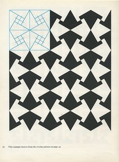 an old book with black and white geometric designs on it's cover, which has blue lines in the middle