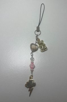 a key chain with charms attached to it