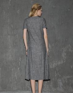 A cool linen dress is an absolute must-have in any woman's wardrobe. The loose-fitting style of this gray dress will give you not only comfort but also a fabulous silhouette no matter what size you are. Whether you decide to wear this dress for lounging around the house or at the office, you'll know that you'll be able to keep cool. Anyone who has experienced the coolness of wearing cool linen fabric would never want to not own linen clothing. This is especially true when it comes to women's dre Gray Shift Dresses, Gray Midi-length Summer Dresses, Gray Shift Dresses For Summer, Gray Knee-length Midi Dress For Summer, Gray Knee-length Summer Midi Dress, Spring Gray Shift Dress, Gray Short Sleeve Midi Dress For Summer, Casual Gray A-line Midi Dress, Chic Gray Short Sleeve Dresses