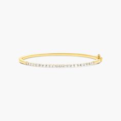 14K Yellow Gold Baguette Lane Lab-Created Diamond Bangle Bracelet. You'll love the anytime appeal of this classic bangle bracelet. Fashioned in 14K yellow gold, this piece showcases a row of horizontally set lab-created baguette diamonds that create a gleaming beam of light. This bangle secures with a single snap clasp. Classic Baguette Diamond Bracelet, Classic Gold Bangle With Baguette Diamonds, Classic Baguette Cut Bangle For Anniversary, Yellow Gold Bangle With Baguette Diamonds, Formal Yellow Gold Bangle With Baguette Diamonds, Gold Bracelets With Baguette Diamonds For Everyday, Everyday Gold Bracelets With Baguette Diamonds, Classic Diamond Baguette Bracelet With Jubilee Design, Classic Baguette Diamond Bracelet With Jubilee Design