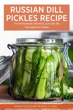 a jar filled with pickles sitting on top of a wooden table