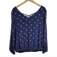 Torrid Navy Chiffon Long Sleeve Elastic Hem Lattice Blouse. Navy With Gold Polka Dots. Lightweight And Strappy Blouse Cast From Sheer Navy Chiffon Dotted With Gold Foil Is Effortless And Endlessly Flattering. Lattice V-Neck. Back V-Neck. Partially Lined. Semi-Sheer Sleeves. Elastic Hem And Sleeves. Chiffon Fabric. Torrid Size 00 Is Equivalent To A Size Medium / Large Or A Size 10. Shell: 100% Polyester; Lining: 100% Polyester. New With Tag. Hem Elastic Is Slightly Twisted, But Doesn't Affect The Blue Flowy Blouse For Party, Fitted Blue Chiffon Blouse, Long Black Blouse, Black Sleeveless Shirt, Blue Vibrant Print V-neck Top, Lace Sleeve Top, Plaid Tunic, Floral Print Chiffon, Black And White Blouse