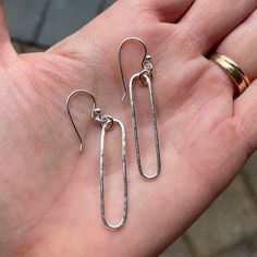 Do you need a gift for someone special? These classic oval earrings go with everything and should be a staple in your jewelry wardrobe! Here are the details: This pair of earrings is 100% handcrafted by me out of sterling silver wire. . . and the long oval measures about 1 1/2" and is hammered for texture. Nickel Free Oval Minimalist Earrings, Nickel-free Oval Minimalist Earrings, Minimalist Nickel-free Oval Earrings, Minimalist Oval Everyday Earrings, Sterling Silver Oblong Earrings For Gift, Sterling Silver Paperclip Earrings As Gift, Minimalist Sterling Silver Oblong Earrings, Silver Oval Earrings For Everyday, Dainty Oval Earrings For Everyday