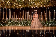 the bride and groom are standing in front of an elaborate floral display at their wedding reception