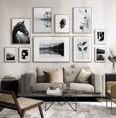 a living room filled with furniture and pictures on the wall