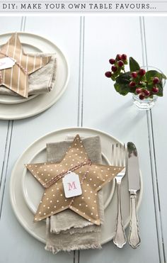 two place settings with star napkins on them