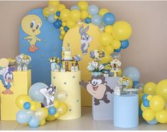 an assortment of balloons and decorations for a children's birthday party with cartoon characters