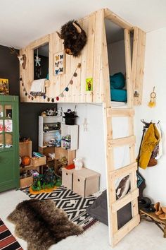 a loft bed is made out of wood and has a ladder to the upper level