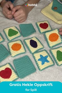 a child is playing with crocheted squares