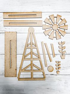 wooden cutouts and shapes on a white wood background