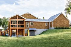 an artist's rendering of a beach house on the grass with trees in the background