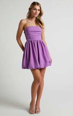 Elevate your party night game with our Shaima Strapless Mini Dress in Orchid. This dress is the perfect choice for those who want to show off their shoulders and embrace their feminine side. Our fit & flare style ensures a flattering silhouette that will have you feeling confident all night long. The vibrant purple hue adds a pop of color to any occasion, while the mini length keeps things flirty and fun.Whether it's a summer soirée or winter wonderland, this dress is transeasonal and versat Summer Strapless Off Shoulder Homecoming Dress, Chic Off Shoulder Dress With Ruched Bodice For Party, Chic Off Shoulder Party Dress With Ruched Bodice, Strapless Off Shoulder Summer Homecoming Dress, Chic Off-shoulder Party Dress With Ruched Bodice, Purple Strapless Dress For Prom, Strapless Mini Dress With Ruched Bodice For Prom, Strapless Mini Dress With Ruched Bodice For Cocktail, Strapless Ruched Corset Dress For Party