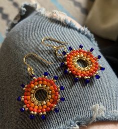 rock these sunburst, custom TSA-approved gold, red-orange, orange and blue handwoven earrings. Handwoven Earrings, Ear Ring, Tsa Approved, Orange Orange, Jewelry Earrings Dangle, Dangle Drop Earrings, Dangle Earrings, Hand Weaving, Etsy Accessories