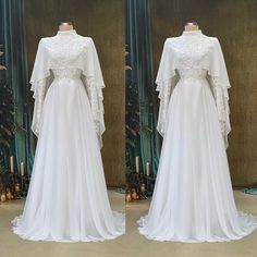 the back and front views of a white wedding dress with long sleeves on display in a store