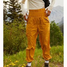 Free People The Noiseless Way Home Joggers. Color: Tumeric Yellow Relaxed Fit Pants With Pockets, Relaxed Fit Yellow Pants With Pockets, Yellow Stretch Pants With Elastic Waistband, Yellow Pants With Elastic Waistband For Fall, Yellow Sporty Bottoms For Outdoor, Sporty Yellow Bottoms For Outdoor, Yellow Stretch Pants With Pockets, Stretch Yellow Pants With Pockets, Yellow High Waist Bottoms With Elastic Waistband