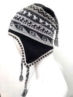 "Unisex Peruvian Alpaca Hat chullo with Earflaps 100% Lining, Soft Fleece Lining Beanie hat, alpaca chullo peruvian hat, peru hat, alpaca hat 100 % Alpaca - High Quality - 100% Lining This is a brand new one of a kind chullo hat made of alpaca, one of the finest yarns in the world. It is soft and warm and features an exquisite intarsia design in a gorgeous color combination. Color combinations are unique due to the handcrafted nature of the product. Order is by main color. Alpaca is considered o Adjustable Alpaca Hat For Outdoor, Alpaca Hat For Outdoor Winter Use, Winter Outdoor Alpaca Hat, Traditional Beanie Hats For Winter, Traditional Beanie For Winter, Adjustable Alpaca Beanie Hat, Adjustable Alpaca Winter Hat, Adjustable Alpaca Hat With Ear Flaps, Traditional Winter Hats With Ear Flaps