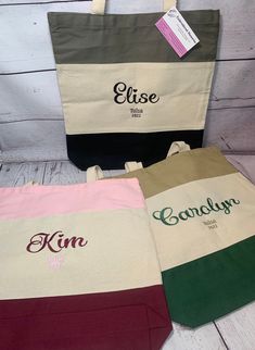 This listing is for one embroidered name or monogram with matching thread color on one of these tri colored canvas tote bags MAKE sure you send met the following information needed to complete your order... Name/monogram,  mini design if purchased, FONT. (Picture lists fonts & then EXTRA font option is on the Kim, Elise, Carolyn bags       THREAD COLOR IS MATCHED TO BOTTOM PORTION COLOR OF BAG Unless you specify thread color at checkout with your other information.... EMBROIDERY OPTIONS AT CHECK Embroidered Items, Bridesmaid Gift Bags, Dog Tote Bag, Dog Tote, Monogram Tote Bags, Pet Bag, Embroidered Name, Monogram Tote, Personalized Tote Bags