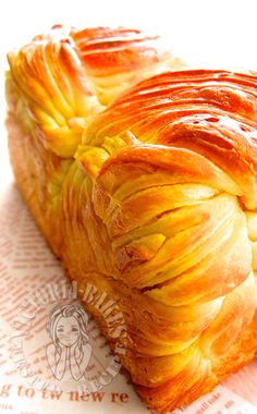 there is a pastry that looks like an artichoke on top of a piece of paper