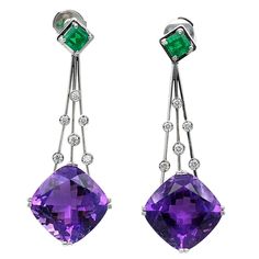 Stunning dangle Earrings set with two cushion shaped amethysts and two square Colombian emeralds. in between on three white gold lines, diamonds highlight the beauty of the piece like droplets on a web. Amethyst : 24,73 Carats, Emeralds: 1,13 carats. Titanic Jewelry, Gold Dangle Earrings, Purple And Green, Emerald Earrings, Emerald Jewelry, Gold Earrings Dangle, Heart Earrings Studs, Fine Earrings, Gorgeous Earrings