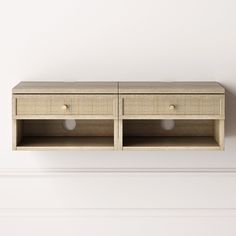 two wooden drawers on the wall with white walls