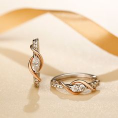 As a couple in love, you are also best friends. Holidays, birthdays, anniversaries, and other special occasions become a celebration of your enduring love and friendship. The beautiful two tone design meaningfully represents the dual nature of your bond. Smaller stones above and below the center stones and a graceful swirling ribbon of polished rose gold tone complete the lovely linear look.Carat Weight: 1.7 ctStone Size: 2.5,1.5 mmNumber of Stones: 20 Stone Shape: RoundStone Color: Diamond Whit A Couple In Love, Twisted Hoop Earrings, Couple In Love, Love And Friendship, Online Earrings, Quality Jewelry, Two Tone, Gold Earrings, Best Friends