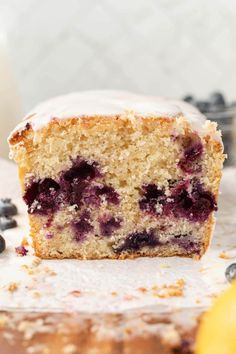 a close up of a piece of cake with blueberries