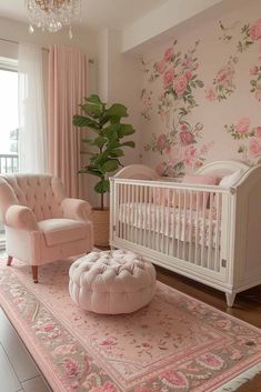 a baby's room with pink furniture and flowers on the wall behind the crib