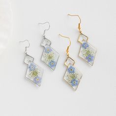 Forget Me Not Flower Earrings for Women | Handmade Real Flower Earrings | Dangle Drop Earrings | Birthday Gift for Her | Christmas Gift 🌿These Forget Me Not Flower Earrings are a stunning work of art that combines the beauty of nature with elegant craftsmanship. Handmade with real Forget Me Not flowers delicately preserved in a crystal-clear resin, these earrings are a unique and personalized gift for any flower lover.  🌿The vibrant blue color of the Forget Me Not flowers is beautifully captur Anniversary Flower Drop Earrings With Ear Wire, Dangle Crystal Earrings With Flower Charm As Gift, Flower-shaped Crystal Earrings With Flower Charm As Gift, Flower-shaped Crystal Earrings With Flower Charm, Flower Shaped Crystal Earrings With Flower Charm, Flower Shaped Crystal Earrings With Flower Charm For Gifts, Dangle Flower Earrings With Ear Wire For Anniversary, Dangle Flower Earrings With Ear Wire For Mother's Day, Anniversary Dangle Flower Earrings