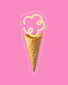 an ice cream cone with the word e on it's side, in front of a pink background