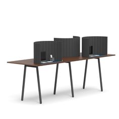 two computer screens sitting on top of a wooden desk