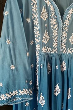 This comfy and beautiful Blue Lucknowi Hand Embroidered Chikankari Short Frock A-Line Peplum Kurta Pant Set is perfect for any event. Handwork embroidery adorns the front, back, and sleeves, and a Croatia border lace adds a touch of elegance. Included wide-leg pants come with handwork embroidery and a convenient elastic waist band. 2 Piece Muslin Cotton Kurta length 36" inches Sleeves length 18" inches A line Bottom length 39" inches Elastic/drawstring waist Side-seam pockets Croatia border lace Chikankari Short Frock, Phulkari Pants, Lucknowi Kurta, Patiala Salwar Suits, Bridal Dupatta, Phulkari Dupatta, Border Lace, Kurta Pant Set, Kurta Dress