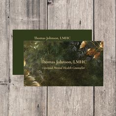 a business card for thomas johnson, l mhc with an image of leaves on it