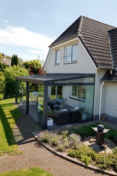 a house with a covered patio and seating area