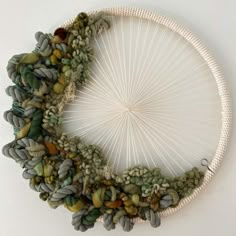 a circular piece of art made out of yarn